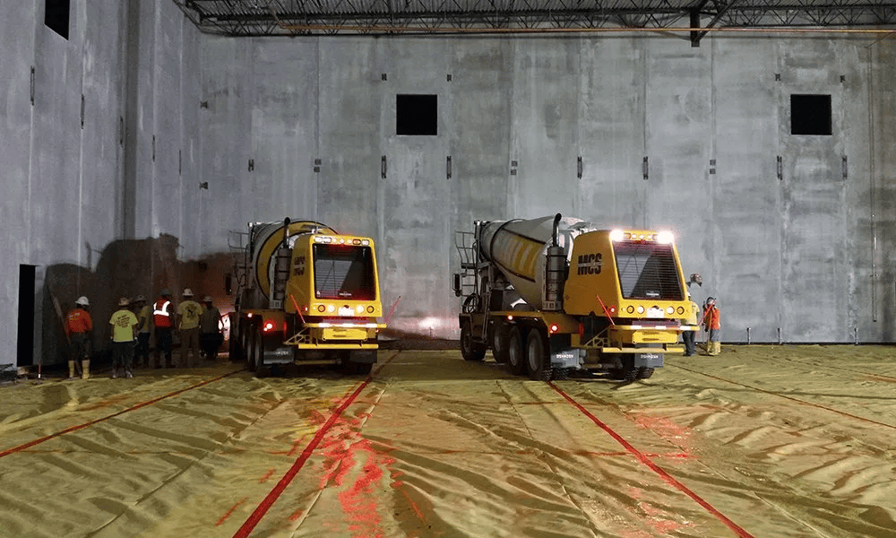 Mixer trucks inside the building