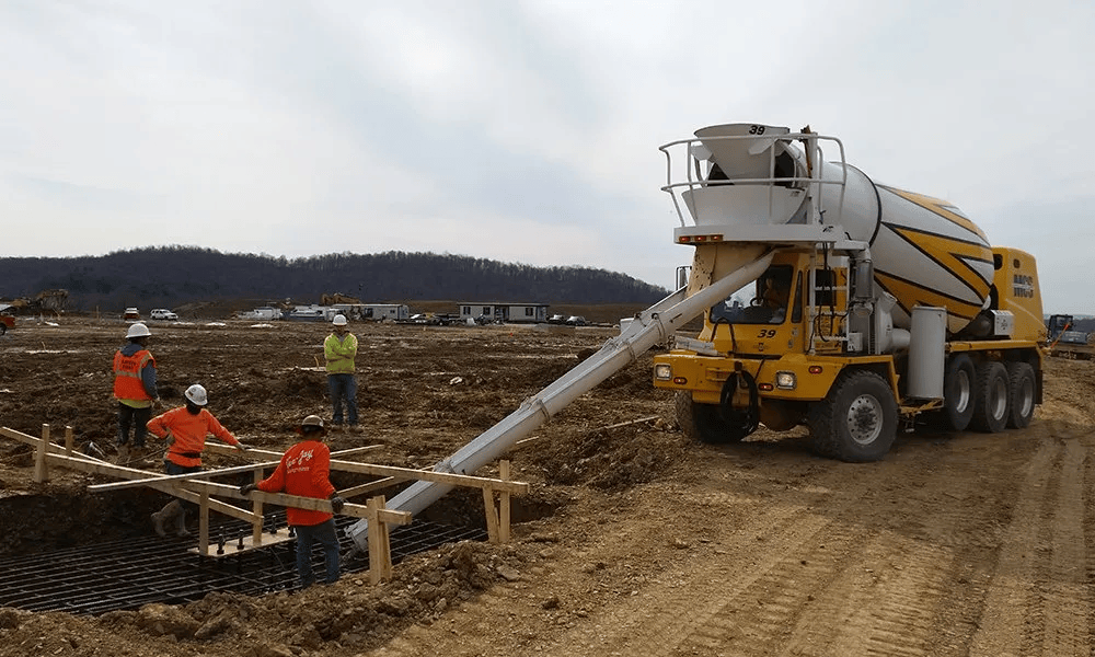 Mixer truck is pouring concrete