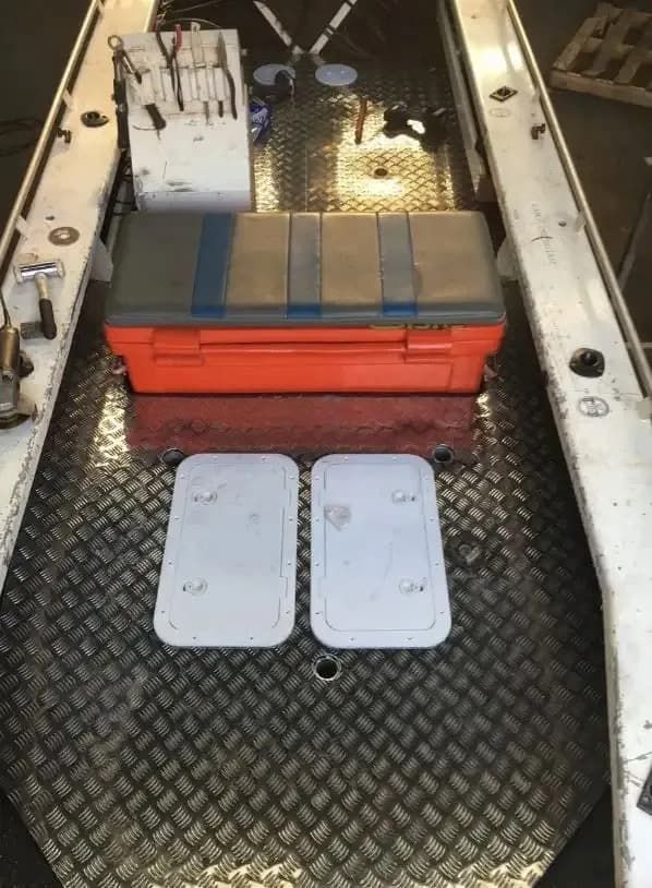 Interior of a Boat Showing a Diamond-patterned Metal Floor