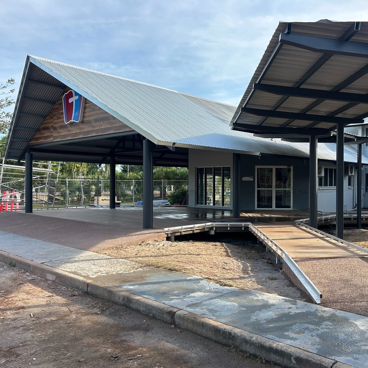 A Large Metal Structure is Being Built on Top of a Building — AKS Welding & Fabrication in Winnellie, NT