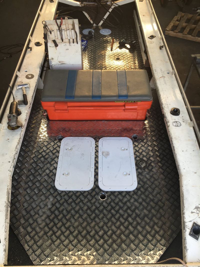 A Boat With a Cooler on Top of It — AKS Welding & Fabrication in Winnellie, NT