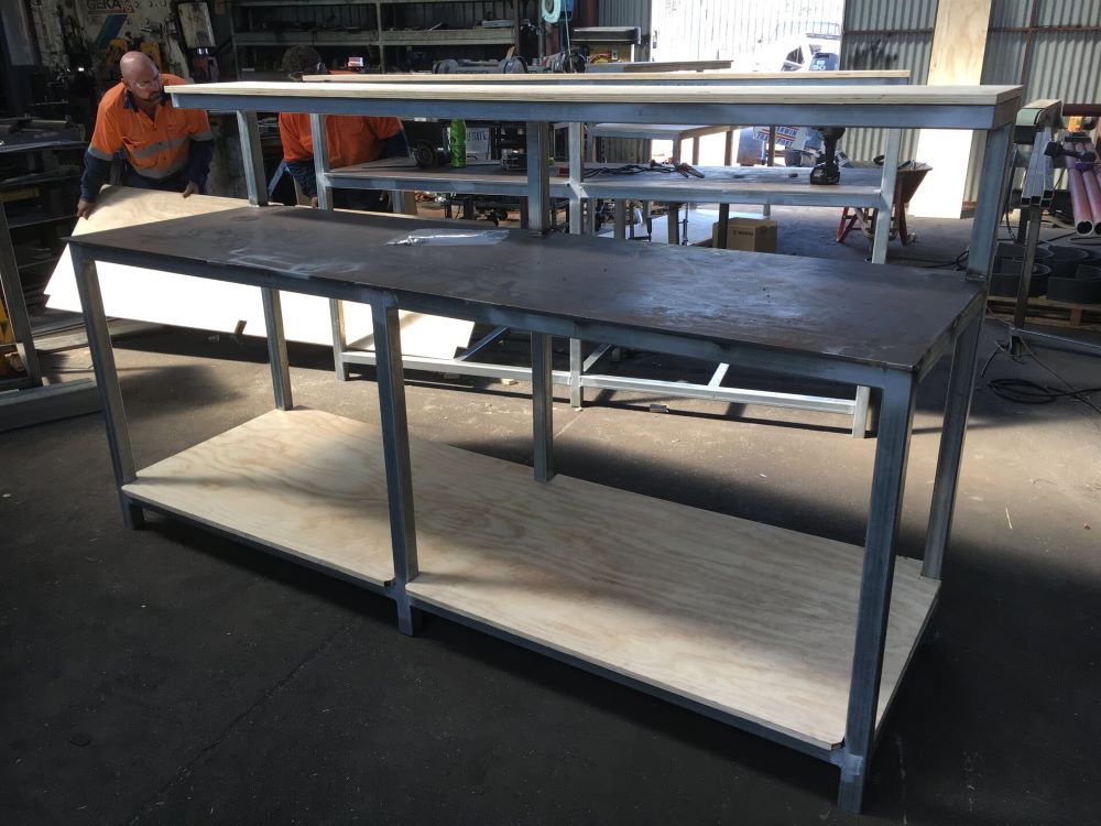 A Metal Table With a Wooden Shelf Underneath It — AKS Welding & Fabrication in Winnellie, NT