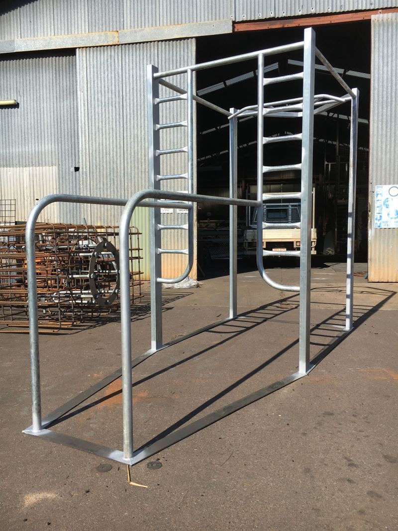 A metal structure is sitting in front of a building