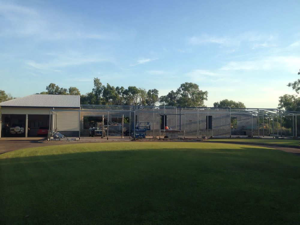 A Baseball Field With a Fence and a Building in the Background — AKS Welding & Fabrication in Winnellie, NT