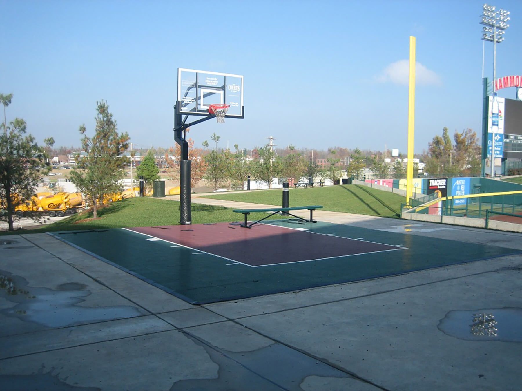 A basketball court in front of a stadium that says ' chase ' on it