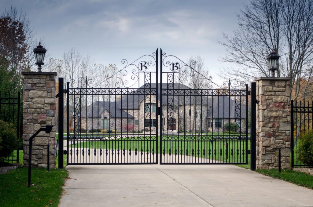 Iron and stone fencing for home in ozark mo