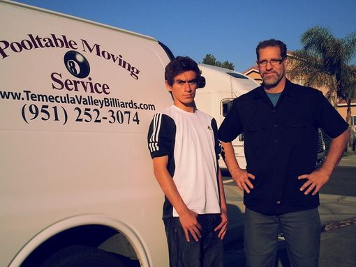 steve in dark polo with a young man
