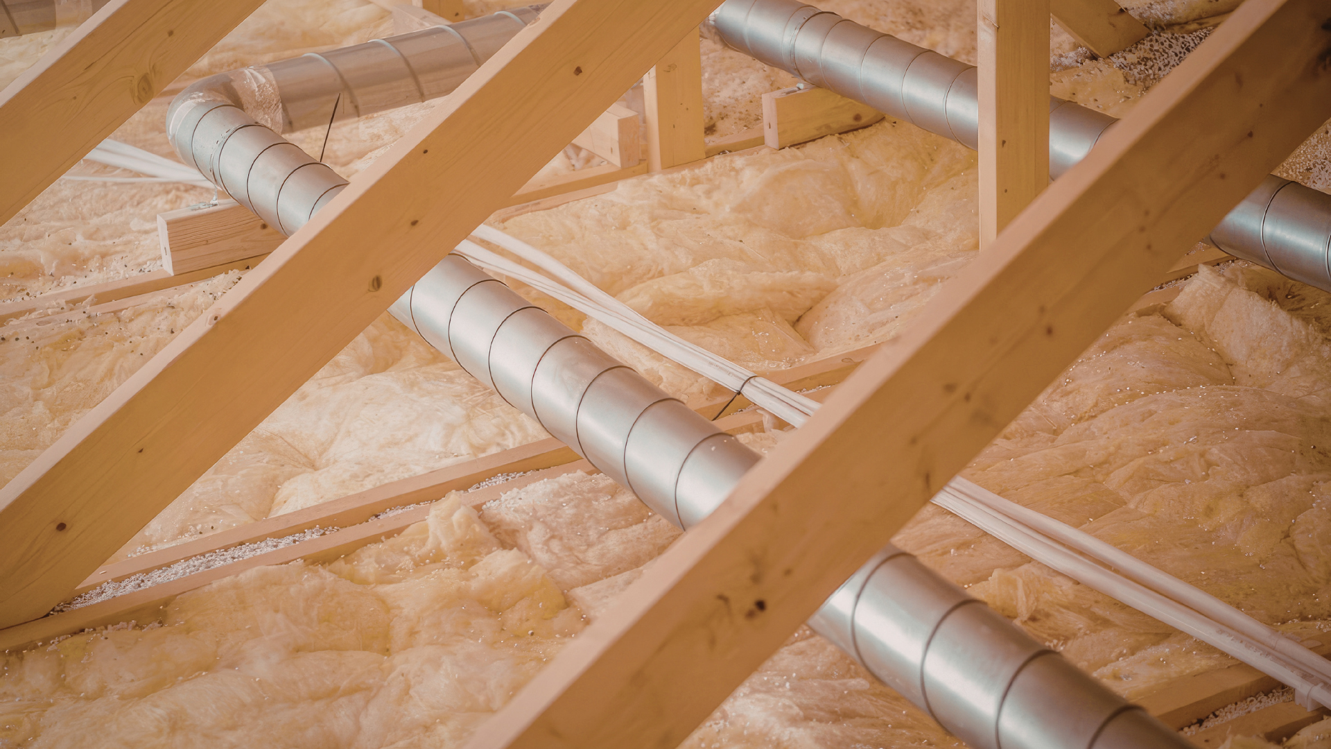 Spray foam contractor sealing crawl space moisture barrier in home