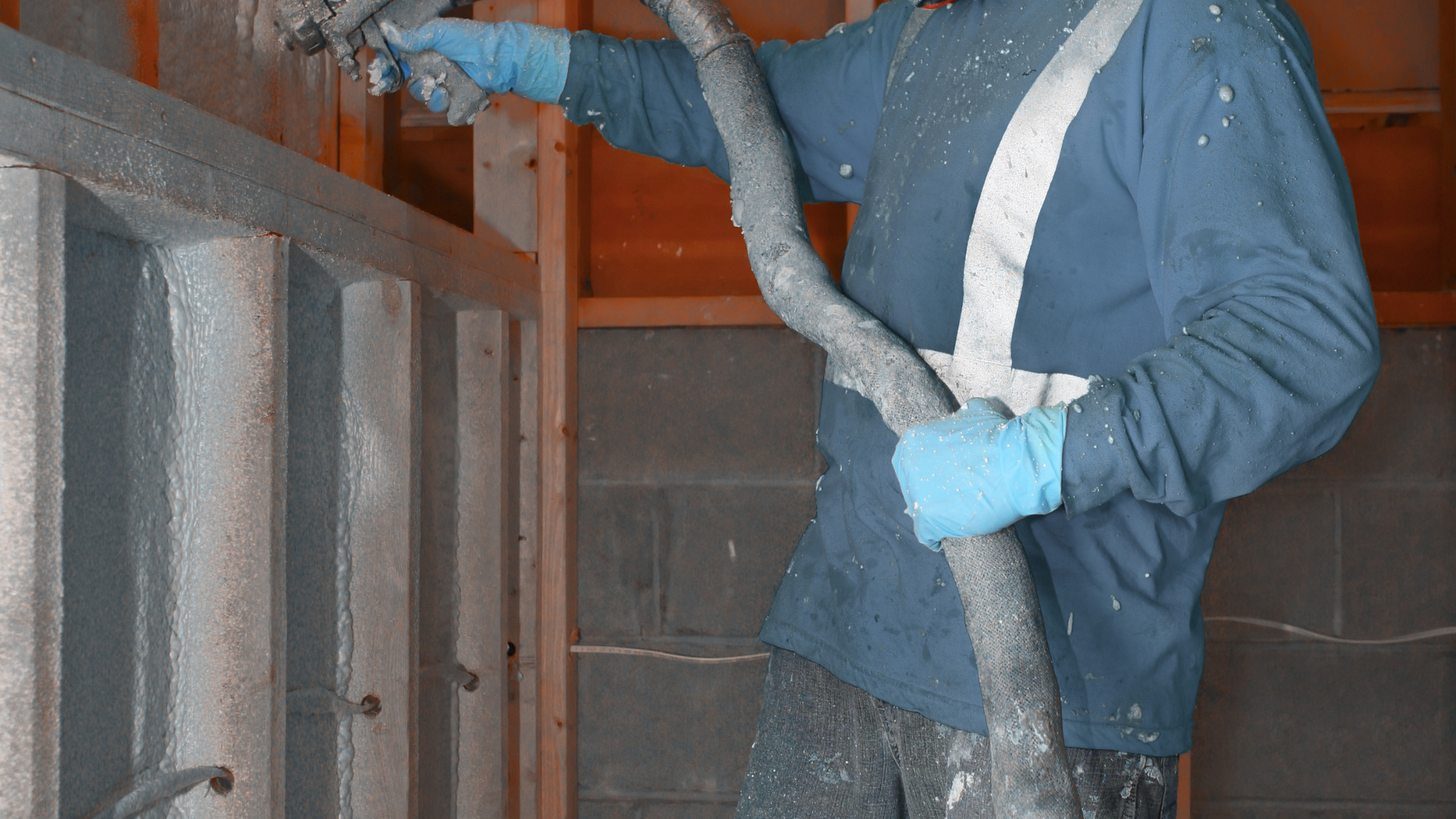 Professional insulation crew applying foam in Baytown Texas property