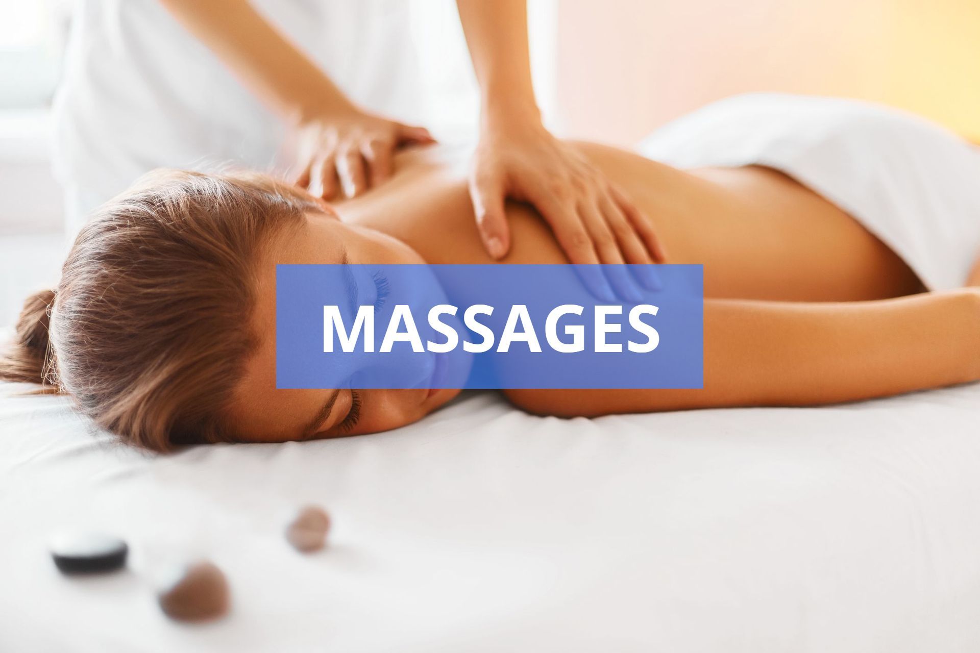 Woman receiving a massage on a massage table; text overlay says 