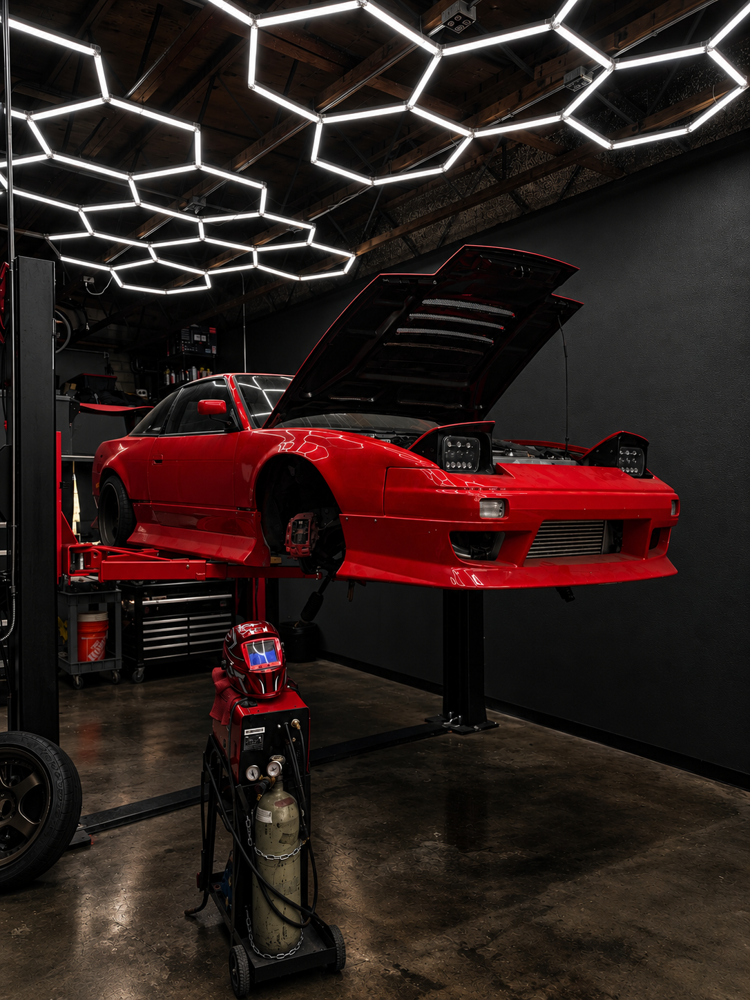 Red performance car in the CD Autoworks shop