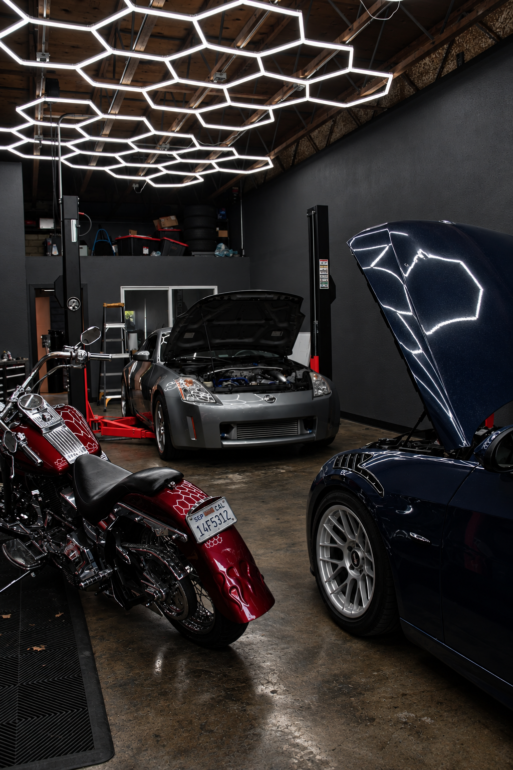 Engine bay of a sports car with the hood open at CD Autoworks