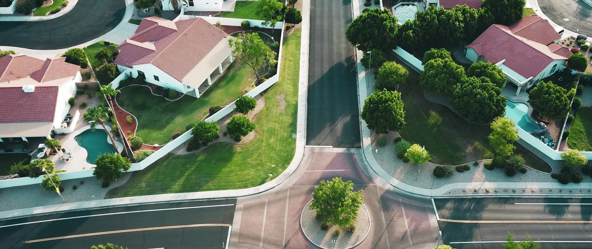 An aerial view of a residential area with lots of houses and trees.