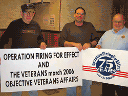 Three men holding signs for