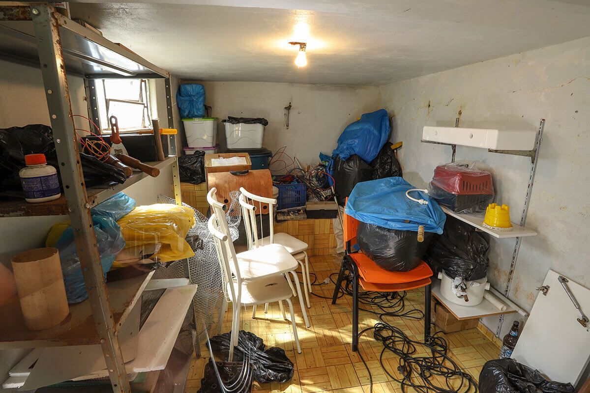 A room filled with lots of boxes and chairs. - dons demolition