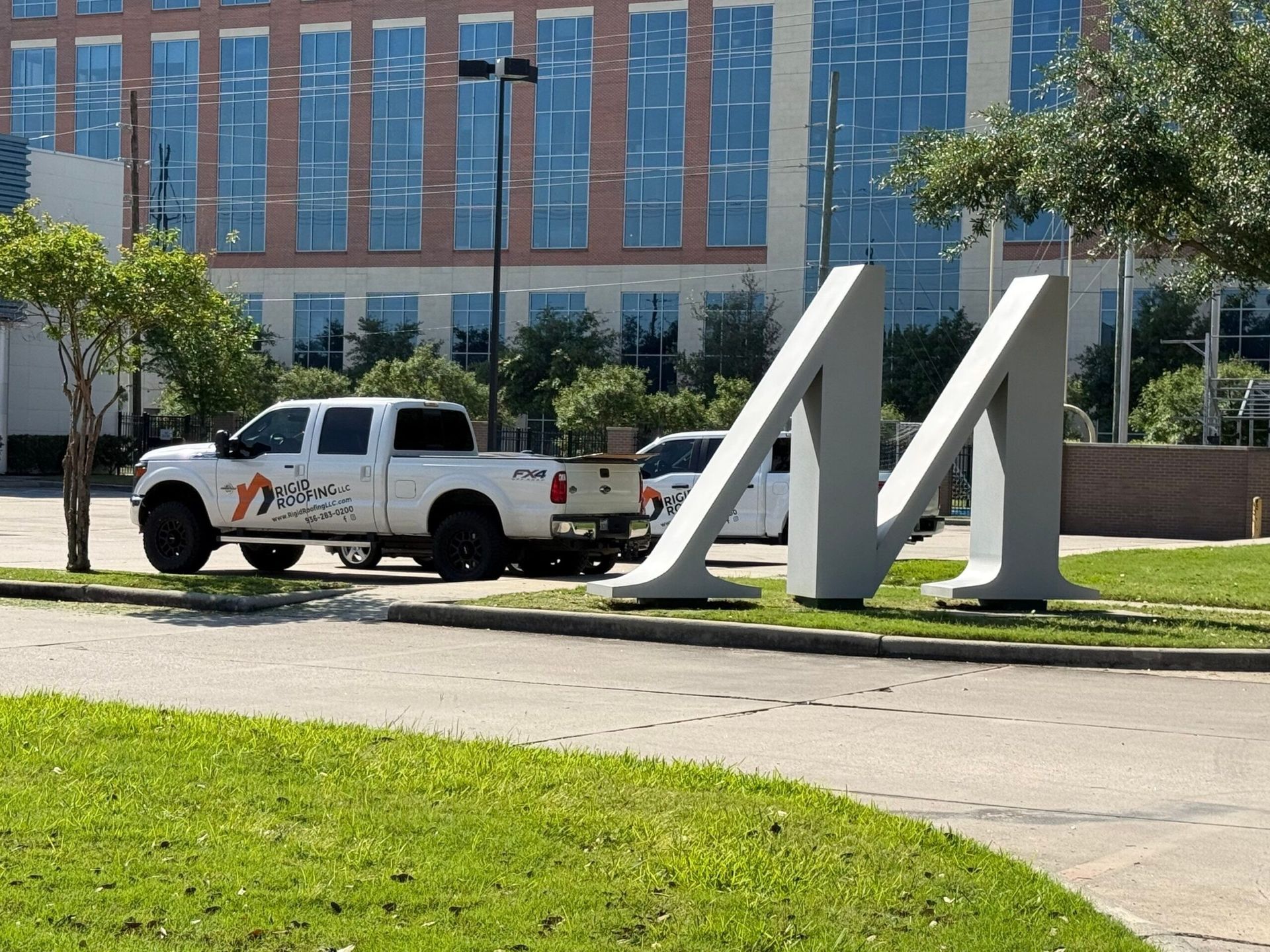 White truck parked near large, gray