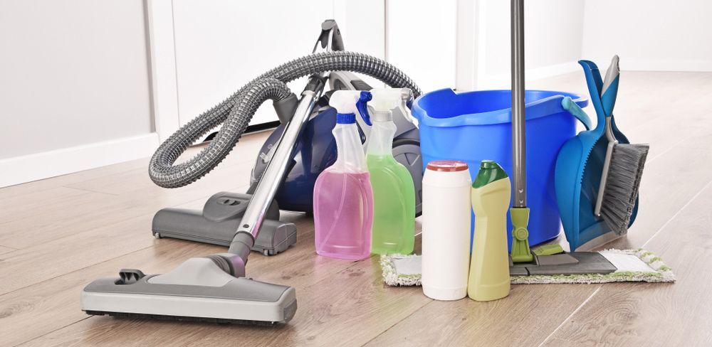 A Vacuum Cleaner, Mop, Bucket, and Cleaning Supplies Are on The Floor — North Coast Commercial Cleaners In Bli Bli, QLD