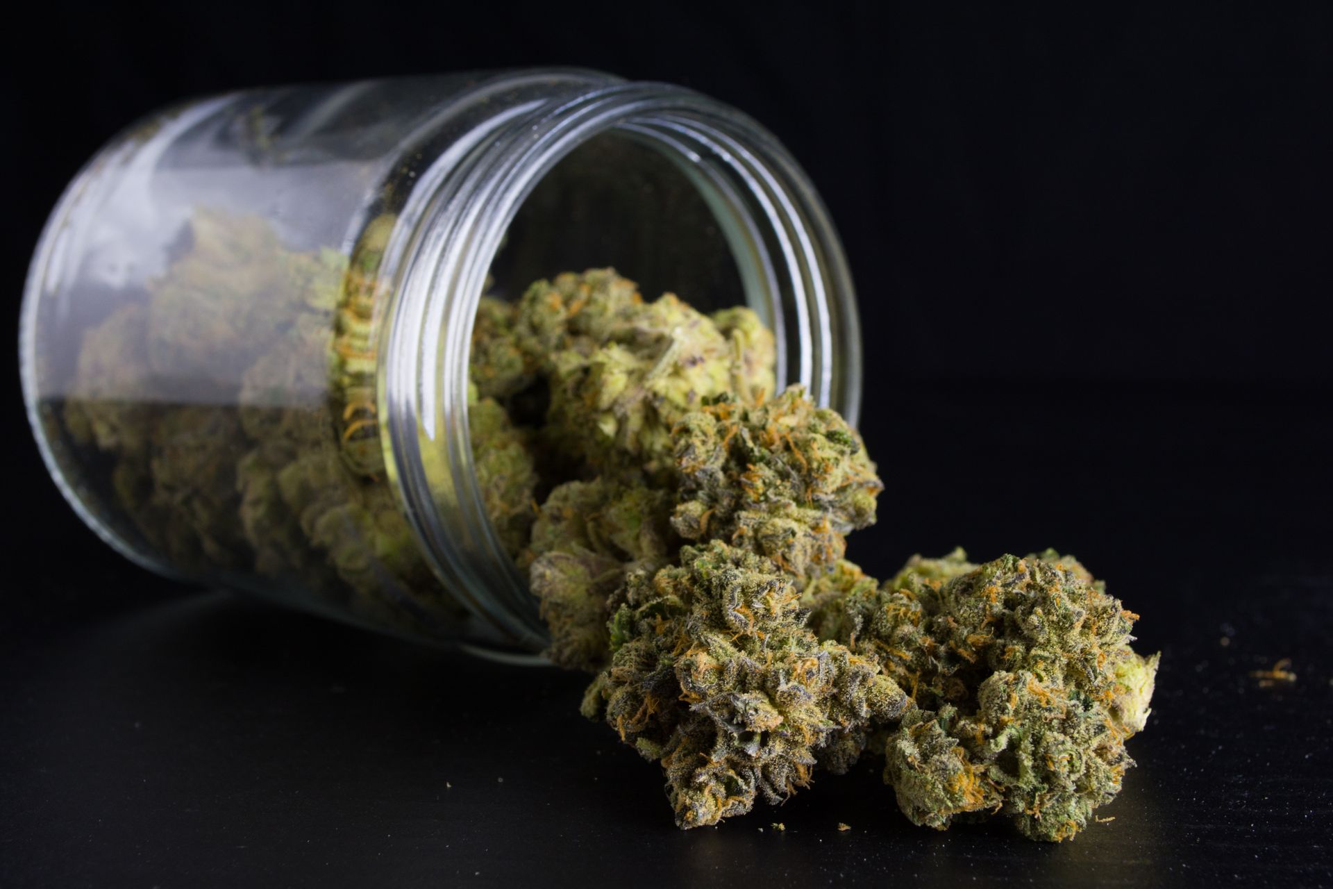 cannabis buds in a jar