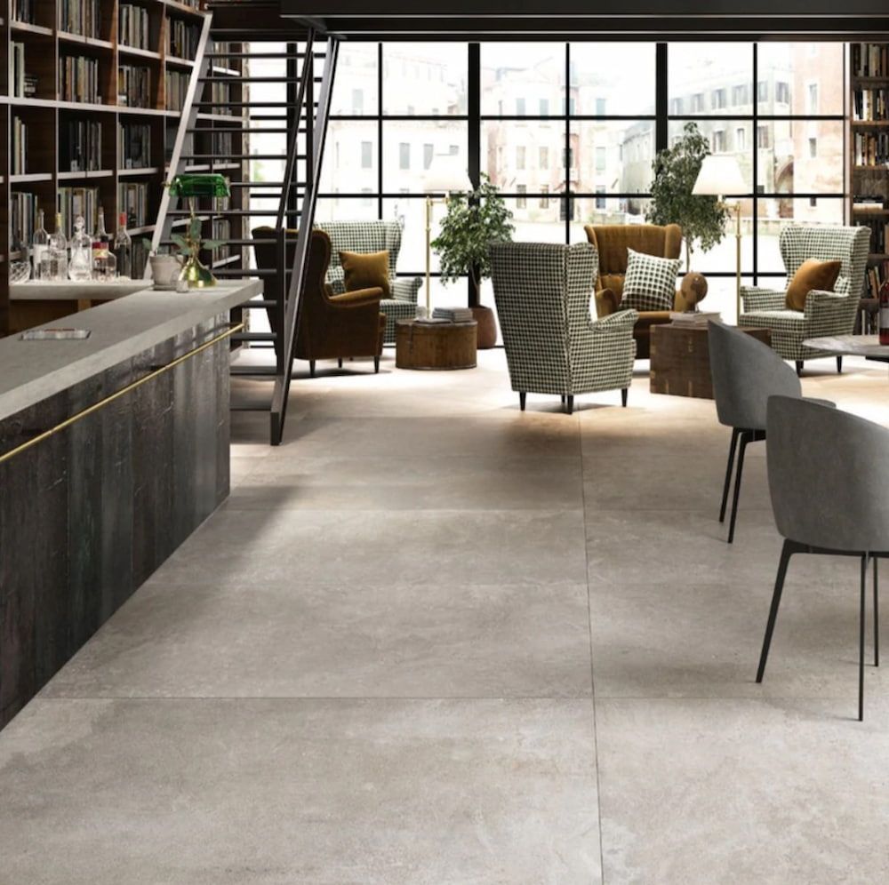 A Living Room With Lots Of Chairs And Tables — Corrimal Ceramic Tiles Pty Ltd in Corrimal, NSW