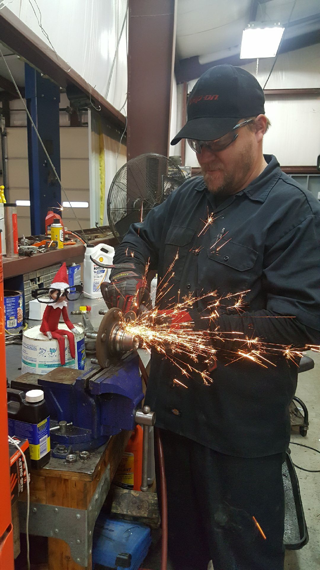 Mechanic grinding metal | Bailey Automotive