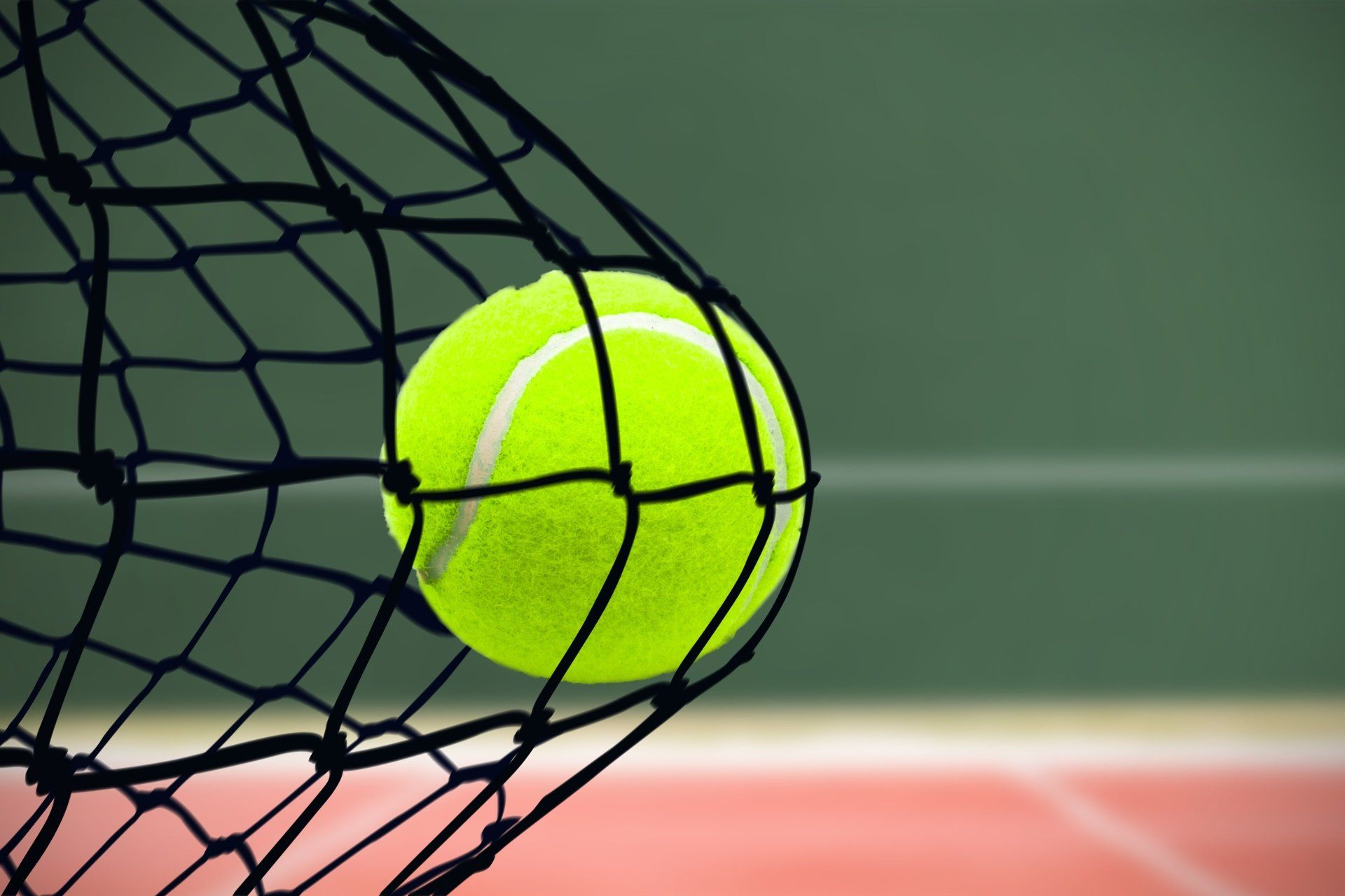Woman playing padel in court