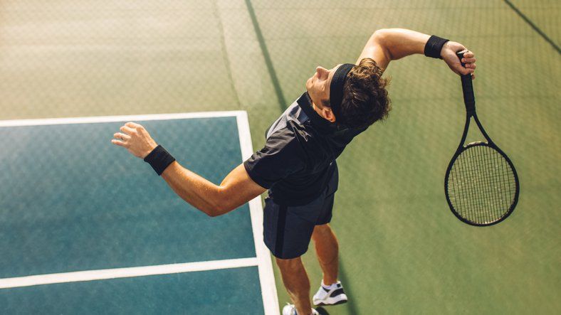 Mixed padel match in a padel court indoor