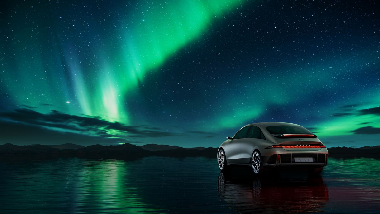 A car is parked in the water under the aurora borealis. Ioniq 6