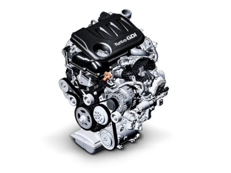 A close up of a car engine on a white background.