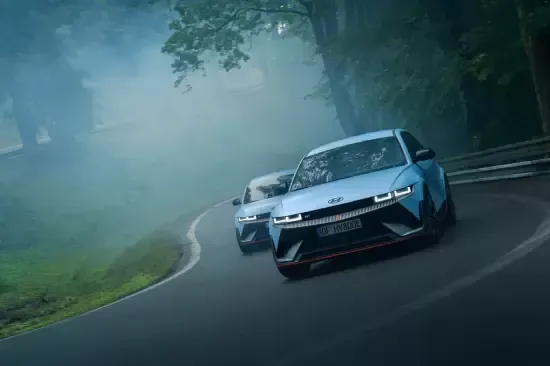 Two cars are driving down a foggy road. Ioniq 5 N