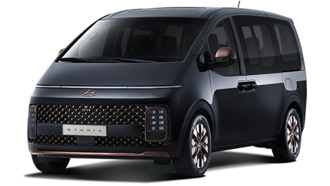 A black minivan is sitting on a white surface. Staria