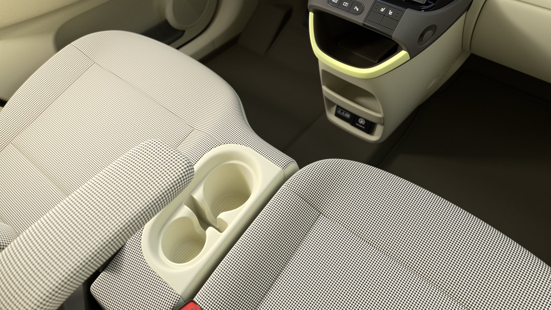 A car with a cup holder on the arm rest Inster 