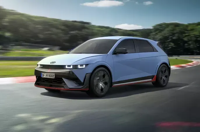 A blue car is driving down a race track. Ioniq 5 N