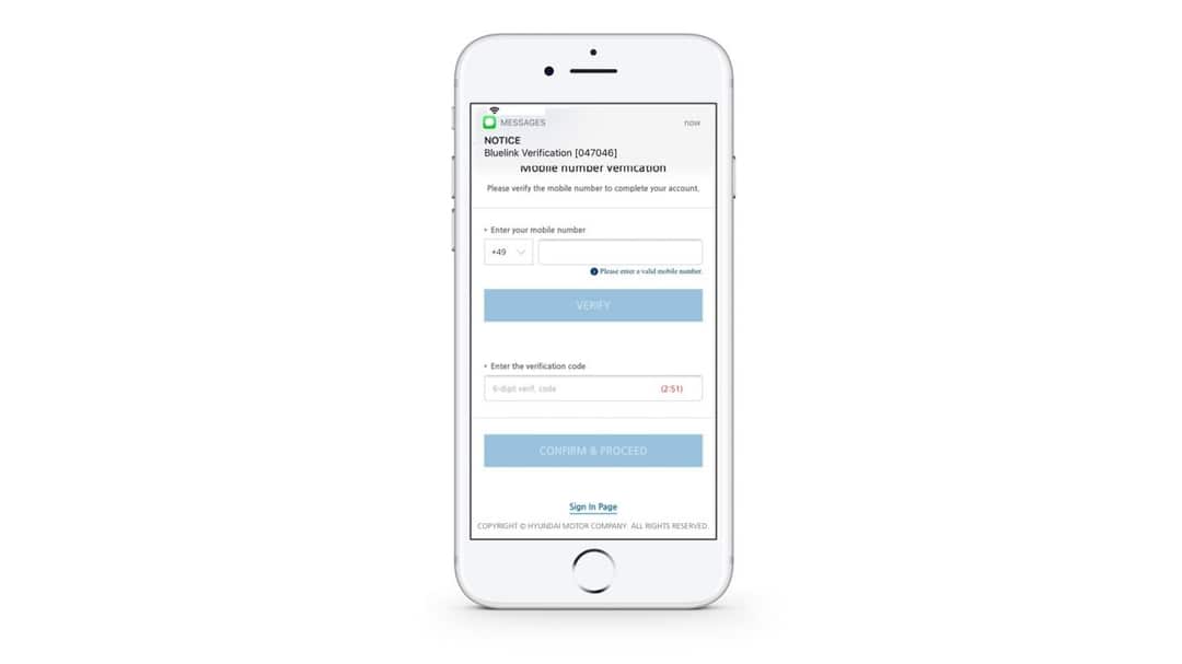 A white cell phone with a login page on it.