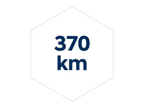 A blue and white hexagon with the words 370 km on it. Inster