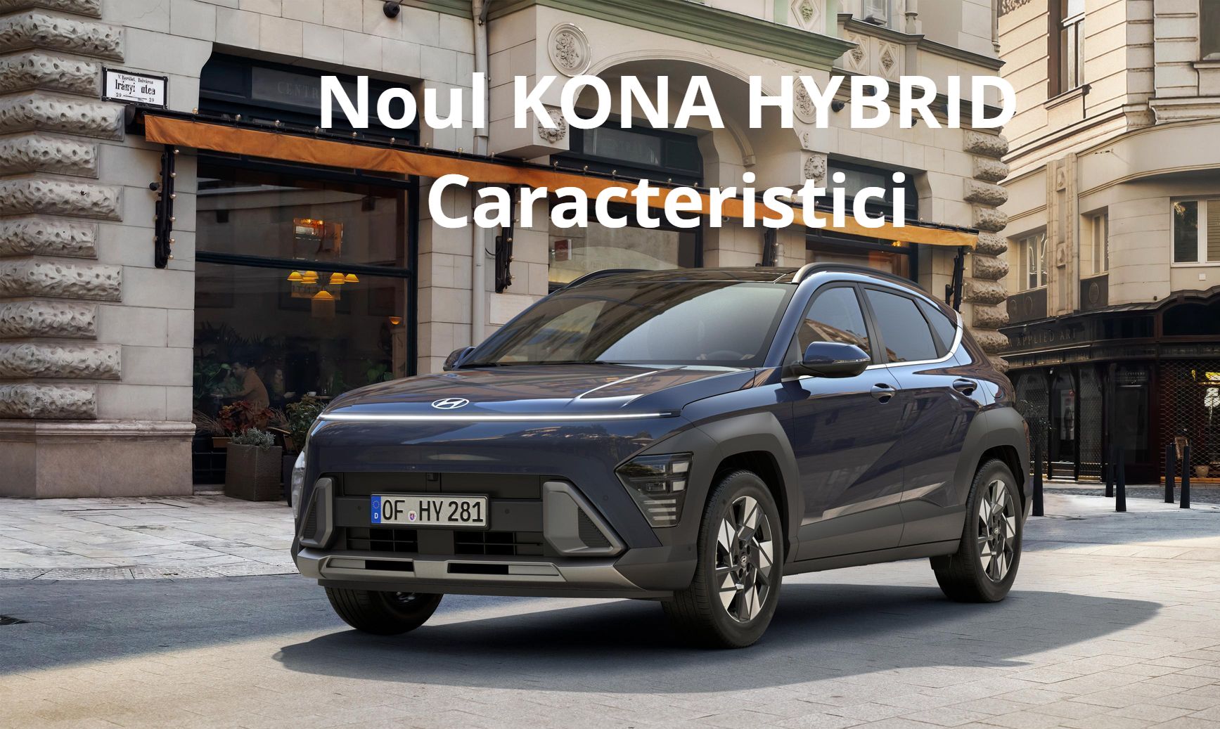 A blue hyundai kona hybrid is parked in front of a building.