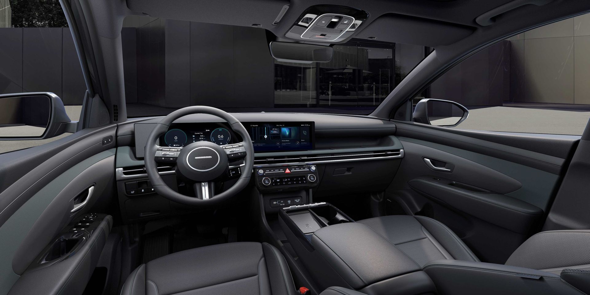 The interior of a car with a steering wheel and a dashboard. tucson 