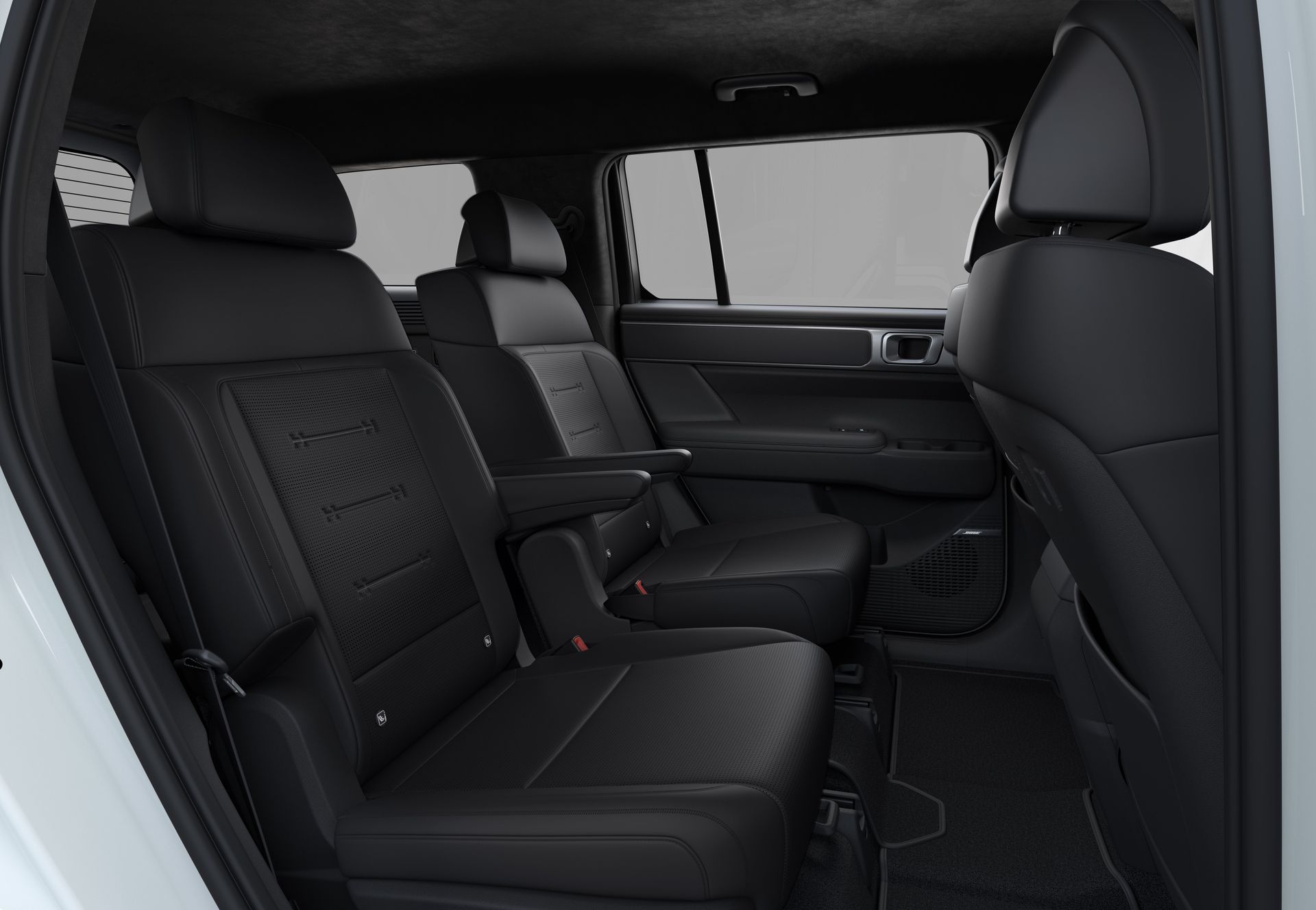 The back seat of a white suv with black leather seats. Santa Fe