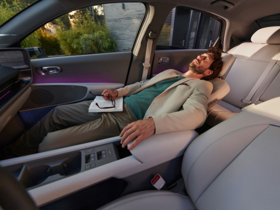 A man is sleeping in the back seat of a car Ioniq 5