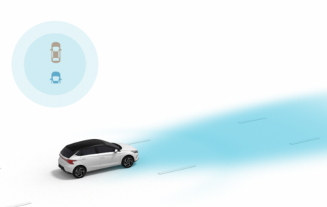 A white car is driving down a road next to a blue circle. i10