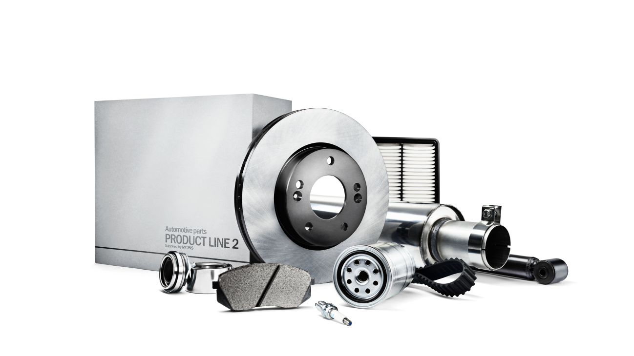 A bunch of car parts are sitting on top of each other on a white background.