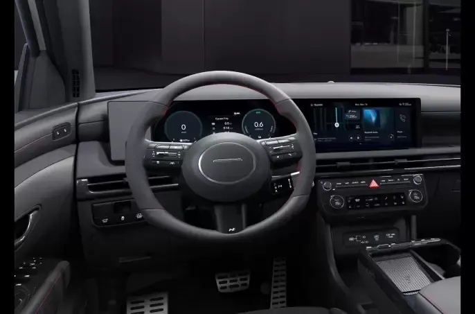 The interior of a car with a steering wheel and dashboard