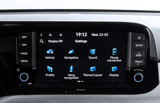 A close up of a car dashboard with a touchscreen display.