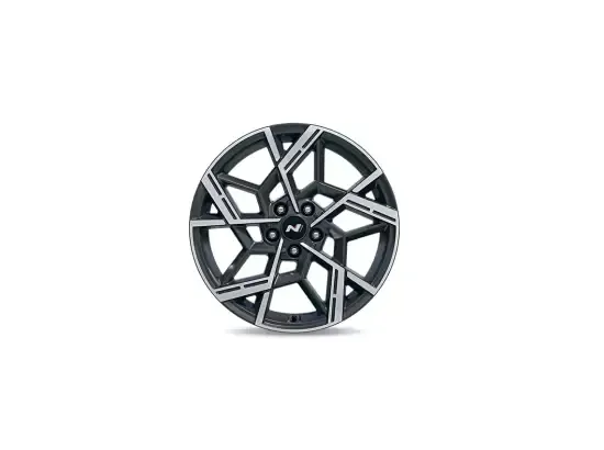 A close up of a car wheel on a white background.
