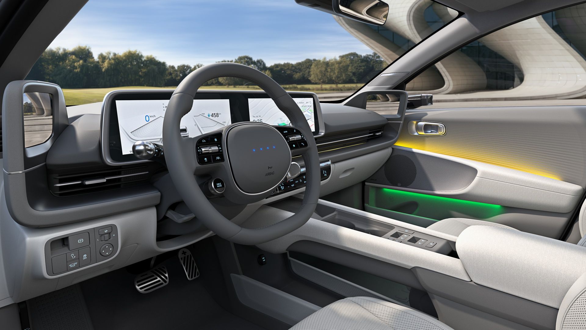The interior of a car with a steering wheel and a dashboard. Ioniq 6