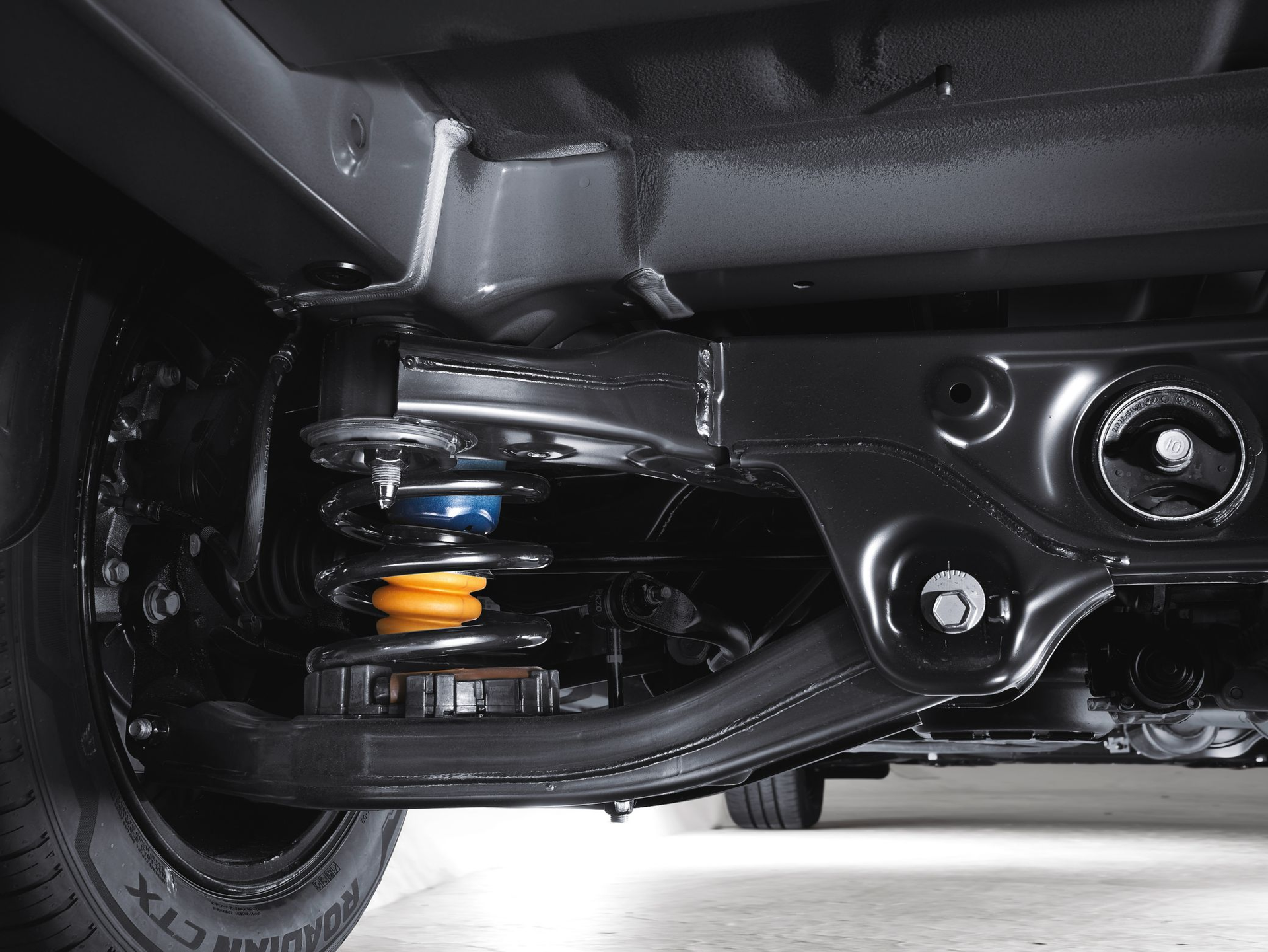 A close up of the rear suspension of a car