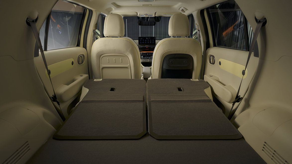 The back seat of a car with the seats folded down. Inster