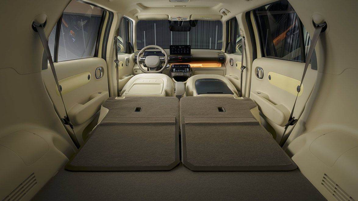 The back seat of a car with the seats folded down. Inster
