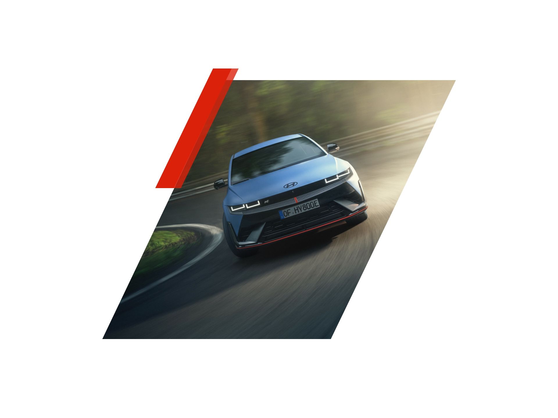 A blue car is driving down a curvy road. Ioniq 5 N