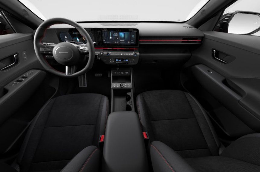 The interior of a car with black seats and a steering wheel Kona N Line Electric