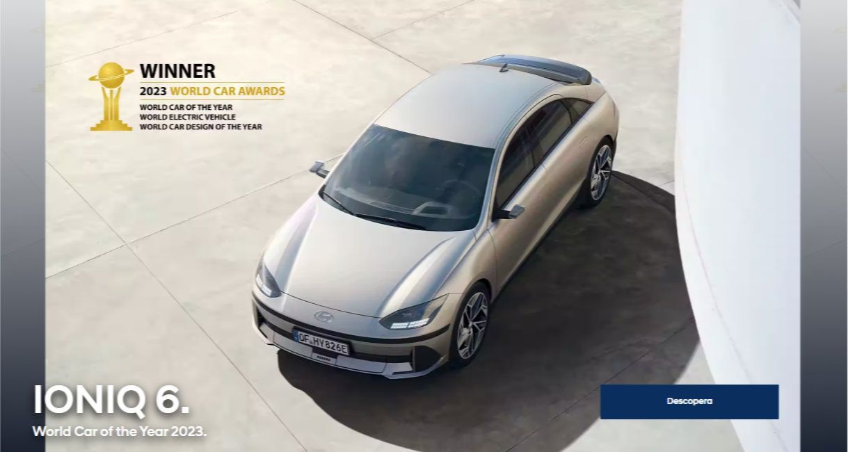 A silver car is parked on the side of the road. Ioniq 6 